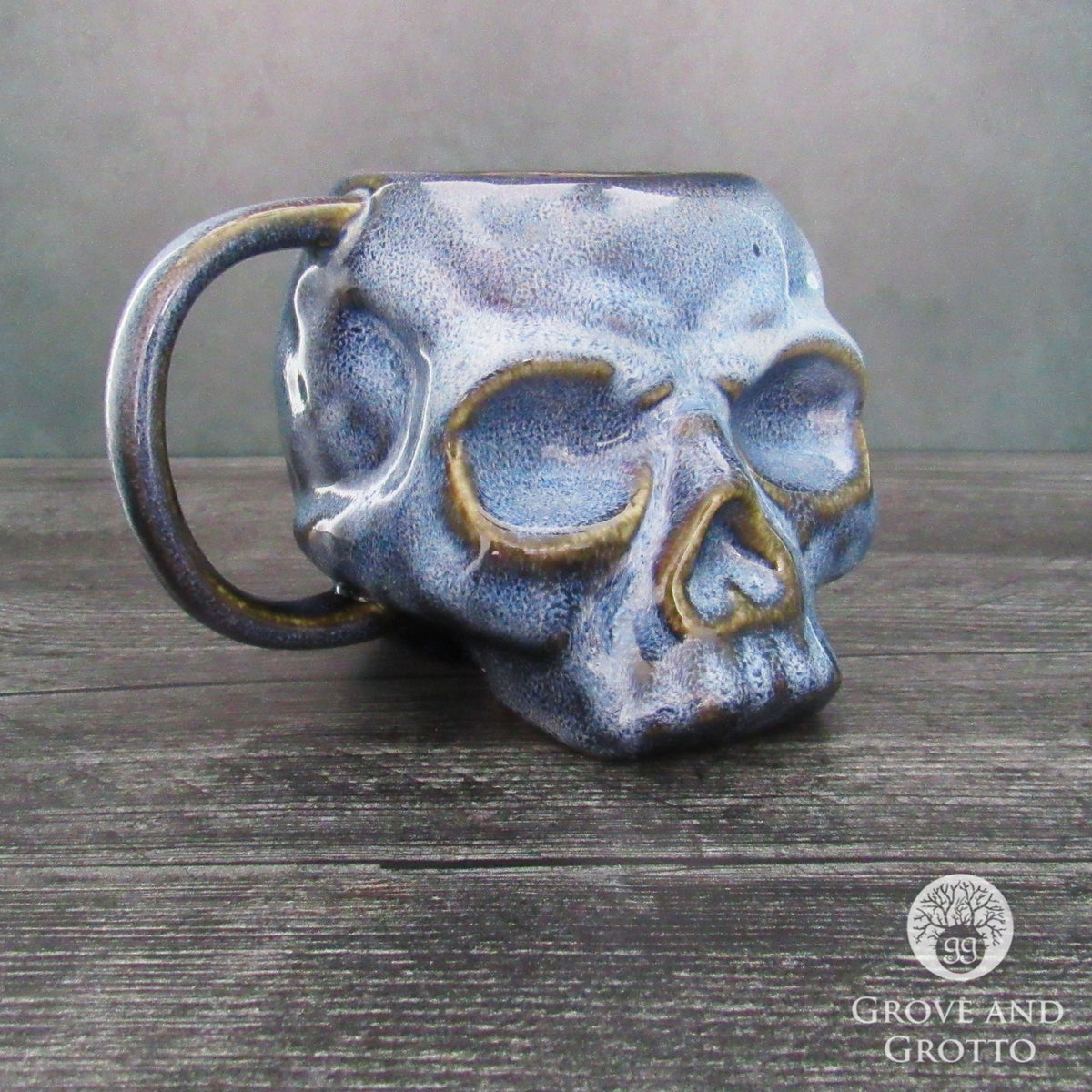 http://www.groveandgrotto.com/cdn/shop/files/Mug_Ceramic_Blue_Skull_GSWM_1200x1200.jpg?v=1684341505